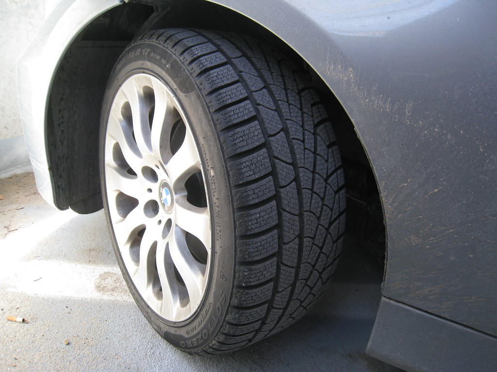 Close-up of a car tire with deep winter tread