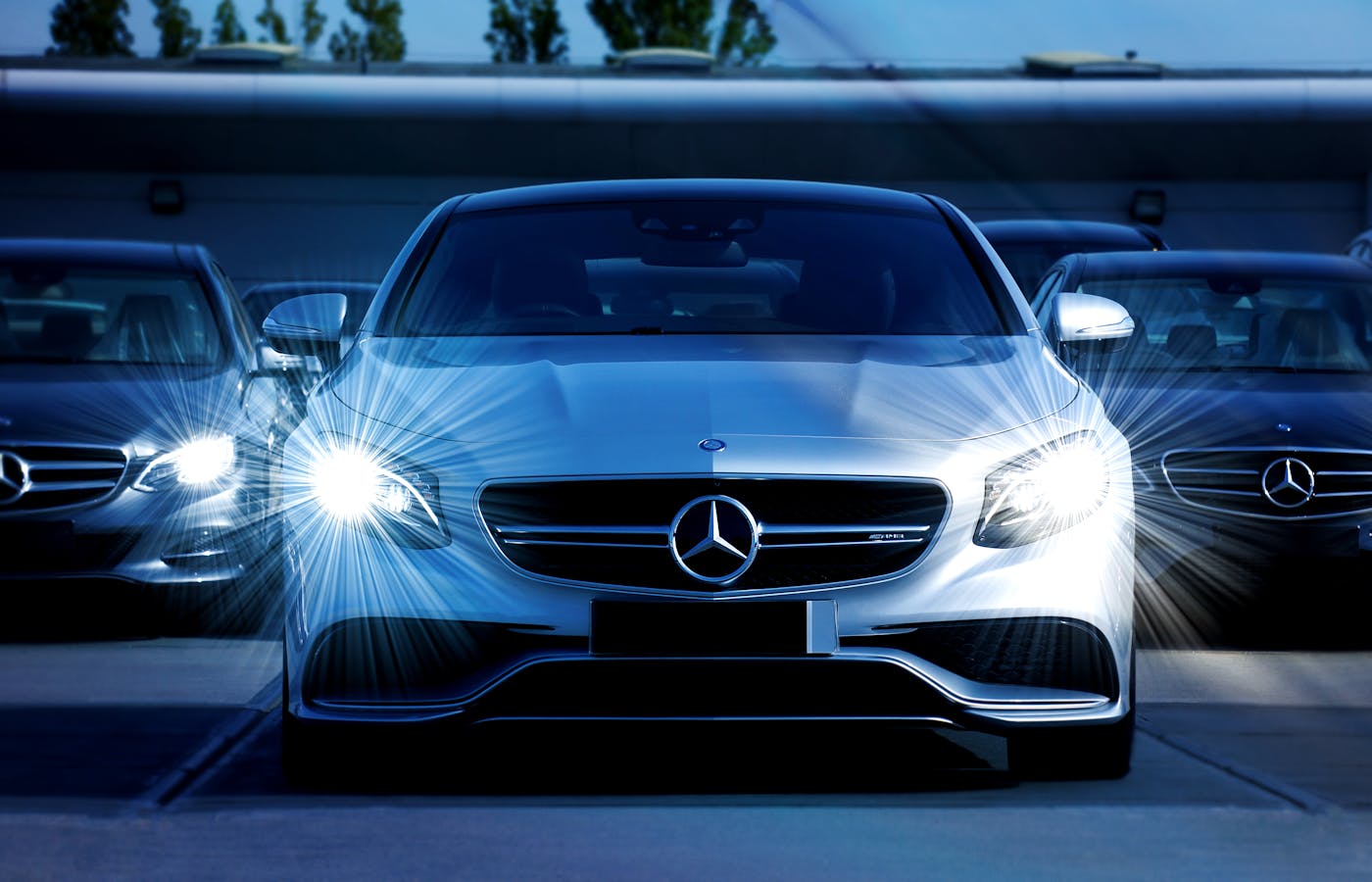 Car headlights shining in a parking area