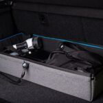 Car trunk organizer holding everyday driving supplies