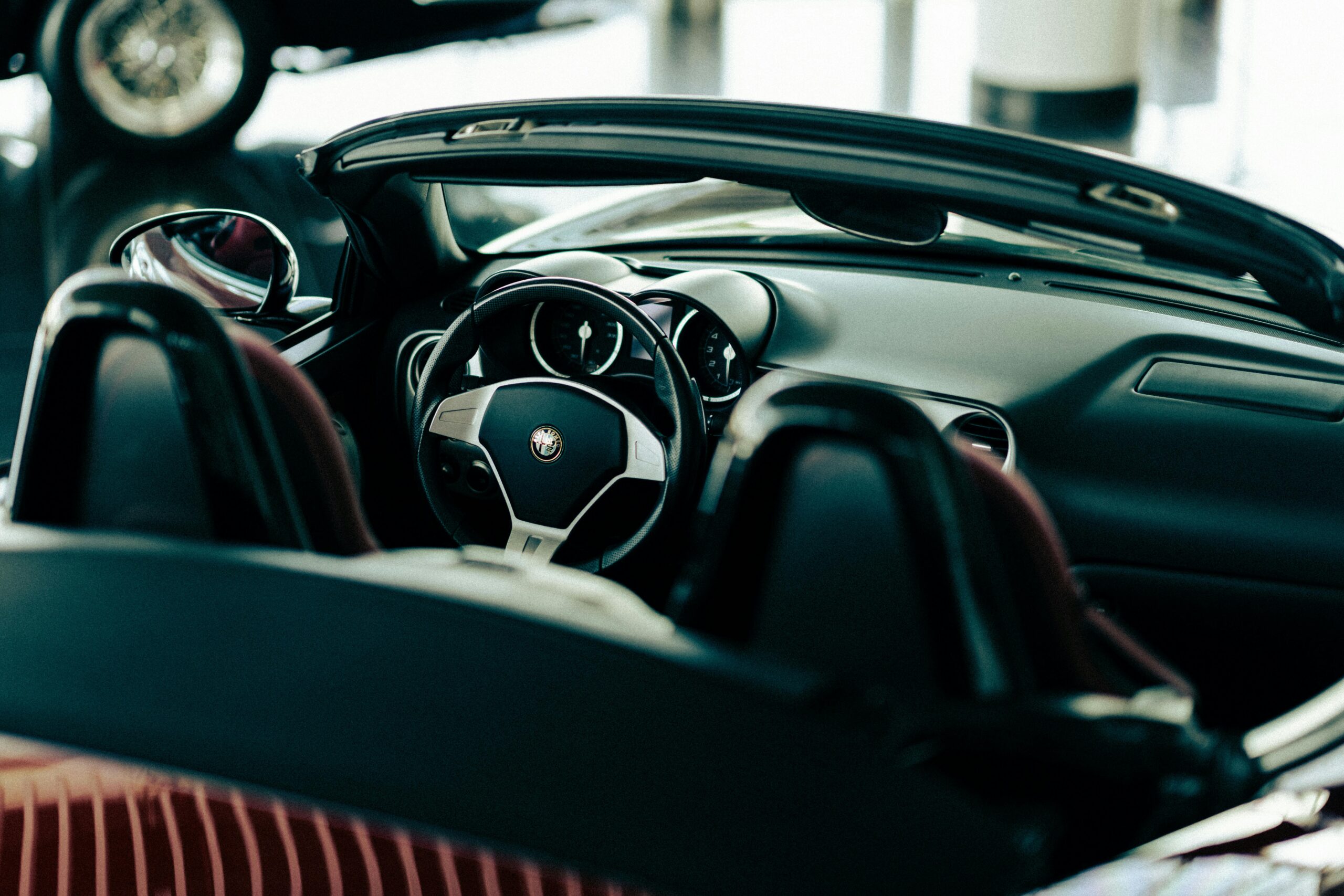 Car interior with steering wheel and dashboard