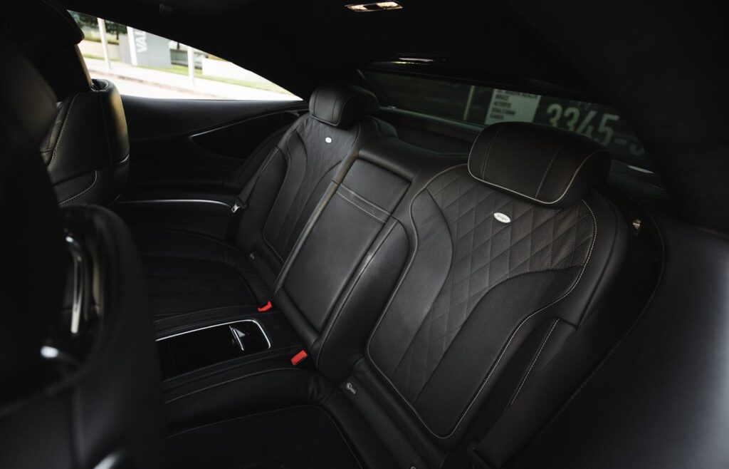 Black leather seats inside a vehicle interior