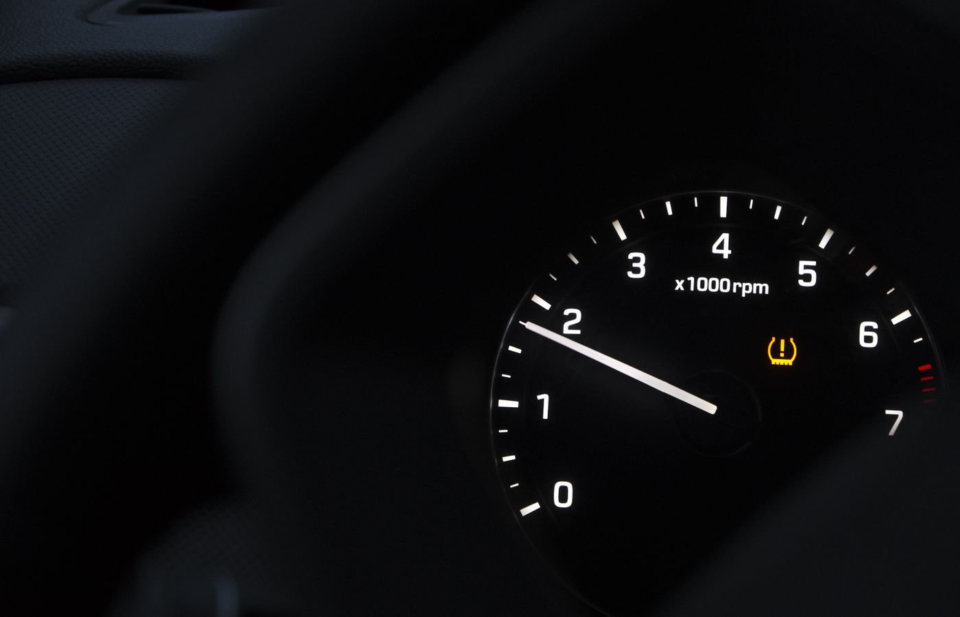 Car tachometer with a tire pressure warning light