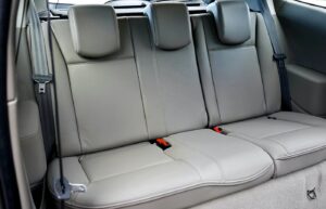 Gray leather car seats in the back of a vehicle