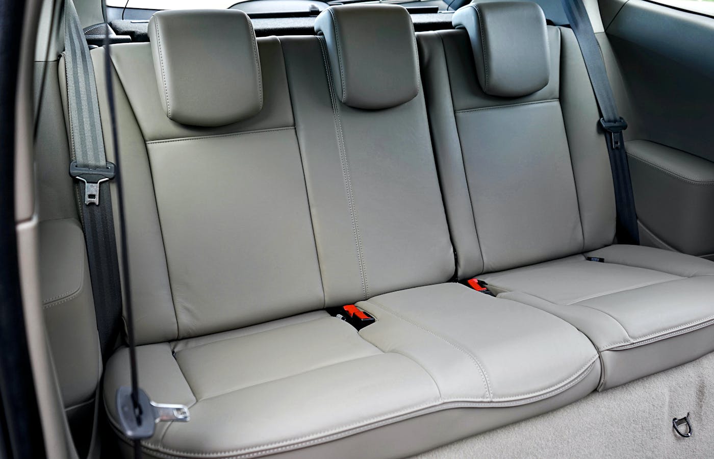 Gray leather car seats in the back of a vehicle